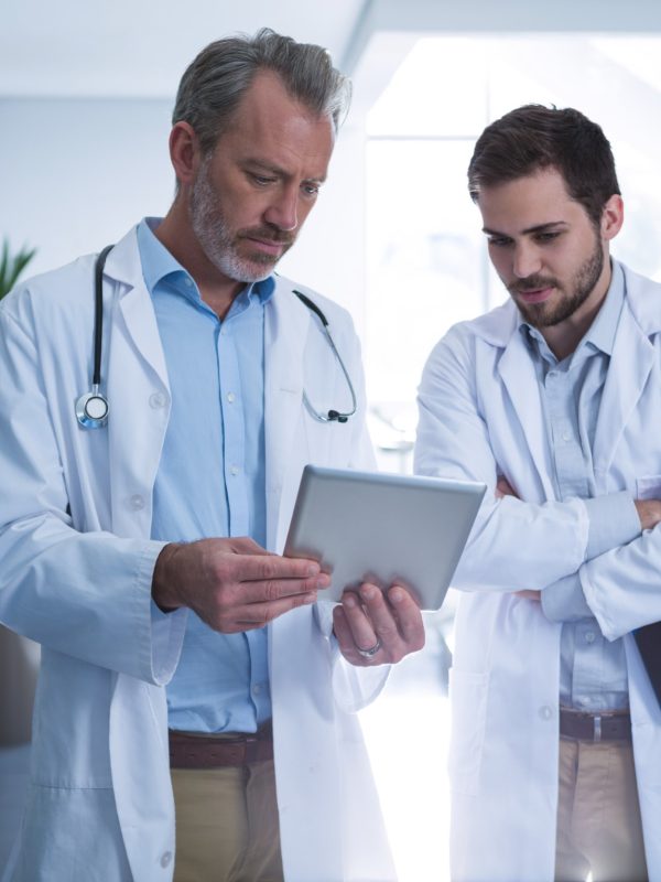 doctors-having-discussion-over-digital-tablet-in-c-2021-08-28-22-13-08-utc-Custom.jpg